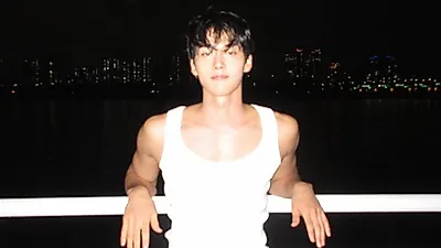 Hong Min-ki cools off at a night pool before My Beloved Thief