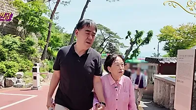 Jeon Won-joo eyes an elevator apartment after her son takes her arm
