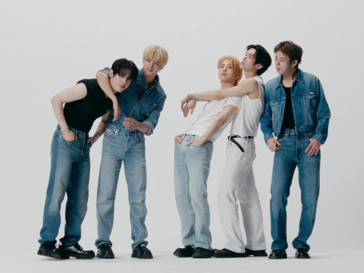 NOWZ members posing together in the 'Achilles' music video
