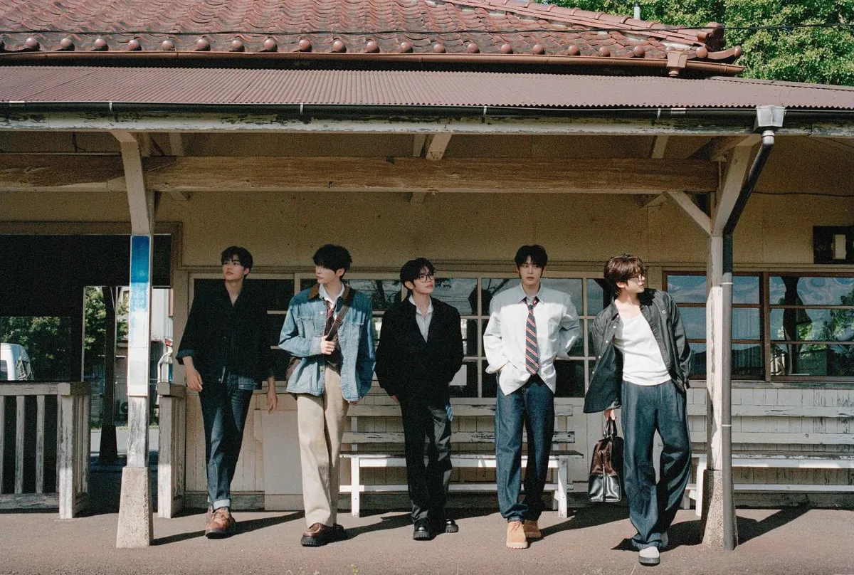 ZEROBASEONE showcases denim styling on a railway station platform